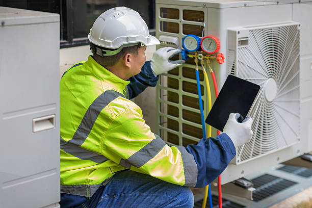 Professional Air Conditioning Repair technician working in Freedom, PA